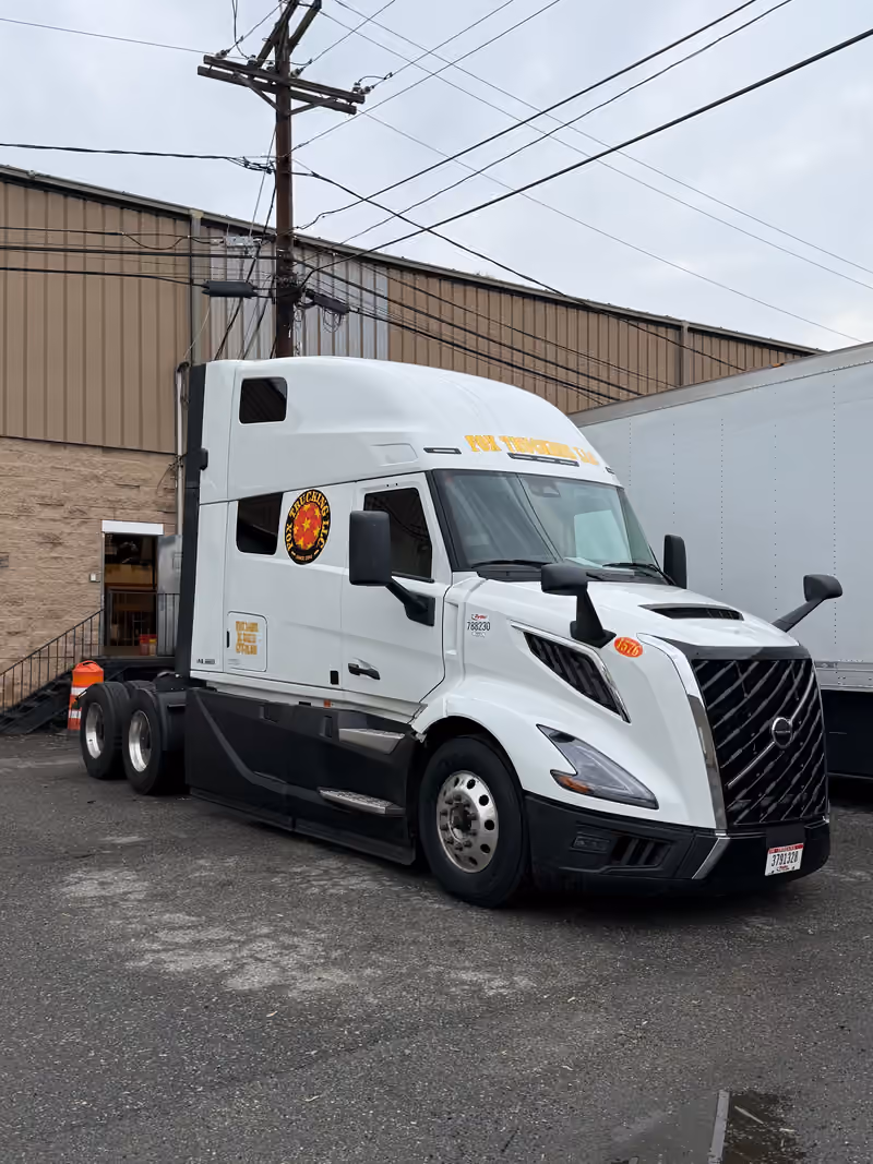Fox Trucking blue Volvo with reefer trailer